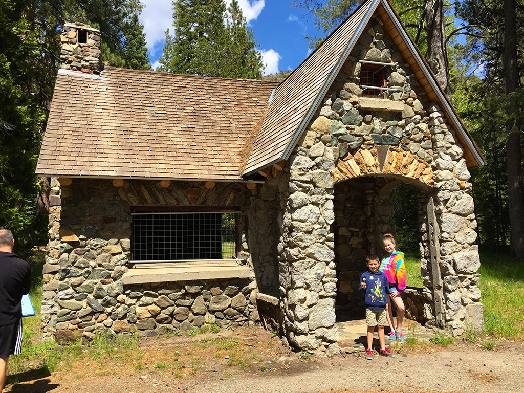 Natalie and Carter in front of the Historic Forest Gift Shop Building