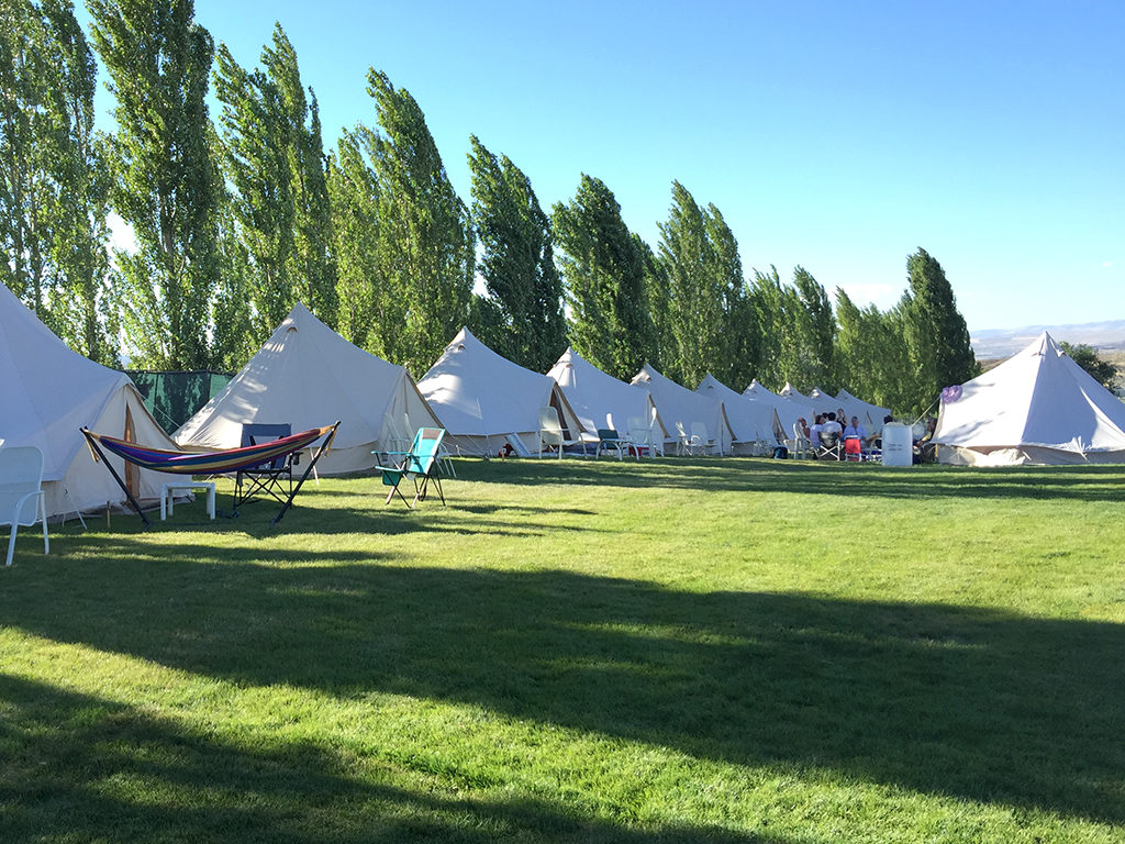 Row of canvas tents at The Gorge Oasis Campground