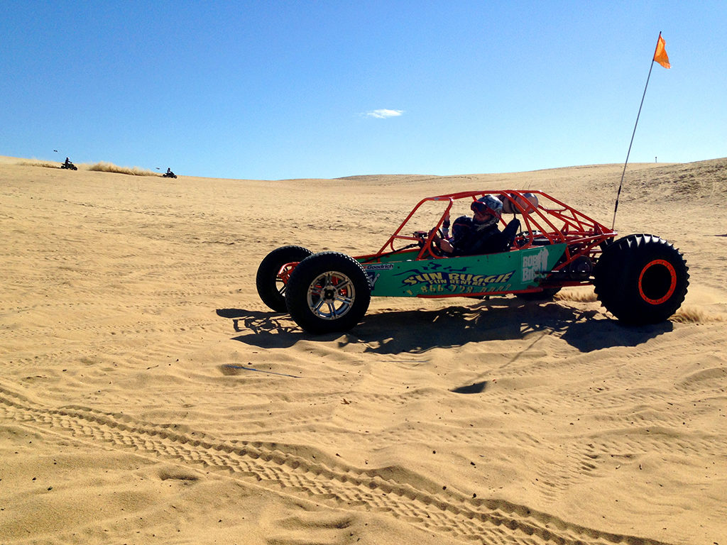 Brian and Natalie Bourn driving a Dune Buggy on the Sand Dunes at Pismo Beach