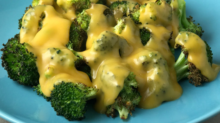 Vegan Cheddar Cheese Sauce Over Roasted Broccoli