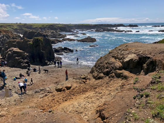 People Treasure Hunting and Looking For Sea Glass At Glass Beach