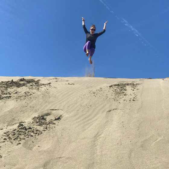 Natalie Bourn Jumping Down Northern California Sand Dunes