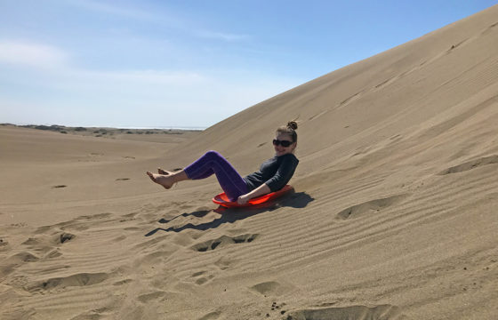 Natalie Bourn Sand Sledding at Ten Mile Dunes