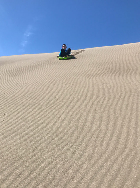 Sand Sledding At Ten Mile Dunes Near Fort Bragg, California
