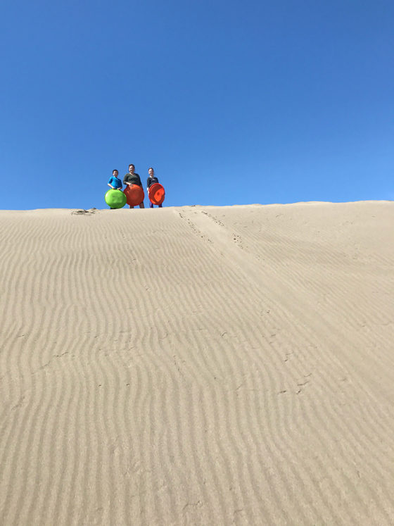 Sand Sledding With Snow Discs at Ten Mile Dunes