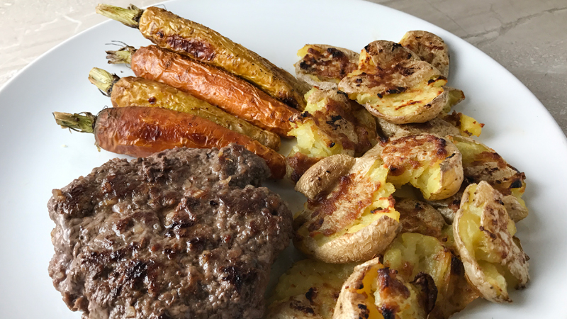 Whole30 Dinner of Grass Fed Beef Burgers, Roasted Carrots, and Garlic Smash Potatoes