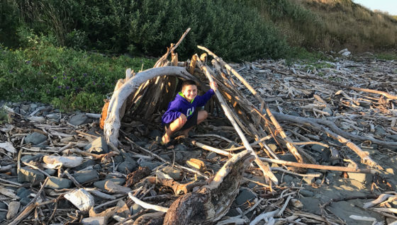 Carter Bourn playing in a Driftwood Fort