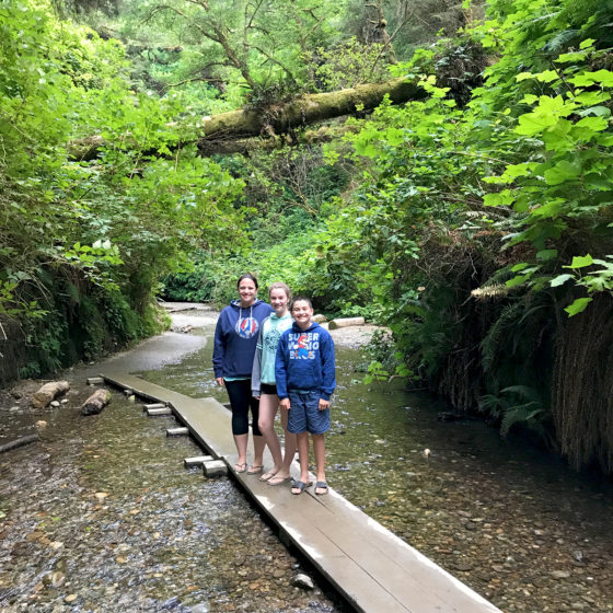 Jennifer, Natalie, and Carter hiking Fern Canyon