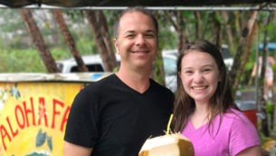 Brian and Natalie Bourn at Manas Aloha Farm Eating Fresh Coconut