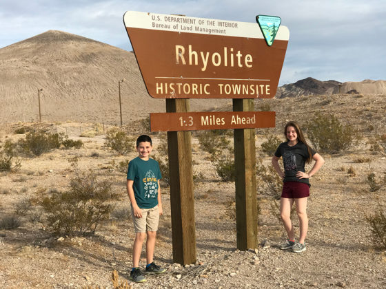 Natalie and Carter Bourn at the Rhyolite Historic Townsite Sign
