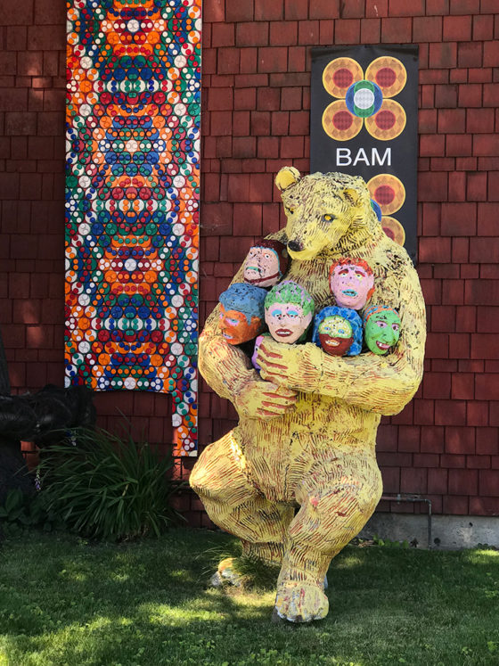 Bear Statue Holding Human Heads