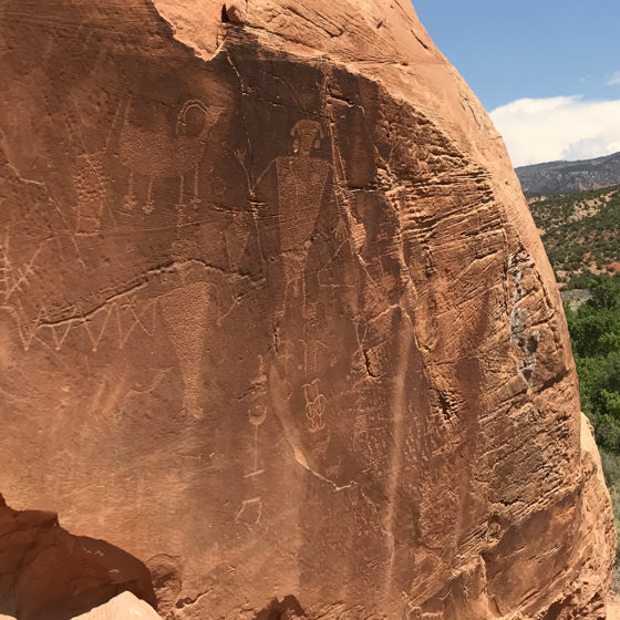 Bighorn Sheep and Human-like Petroglyphs Carved By The Fremont People