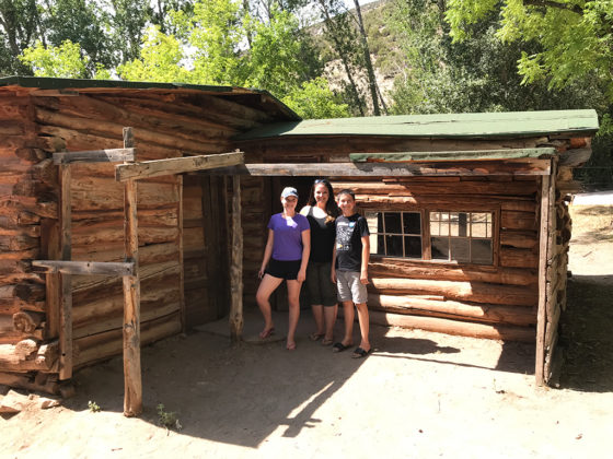 Natalie, Jennifer, and Carter Bourn at the Josie Morris Cabin in Dinosaur National Monument