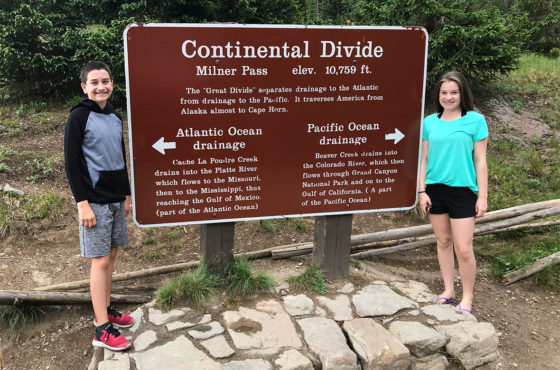 Natalie and Carter Bourn Standing On Continental Divide At Rocky Mountain National Park