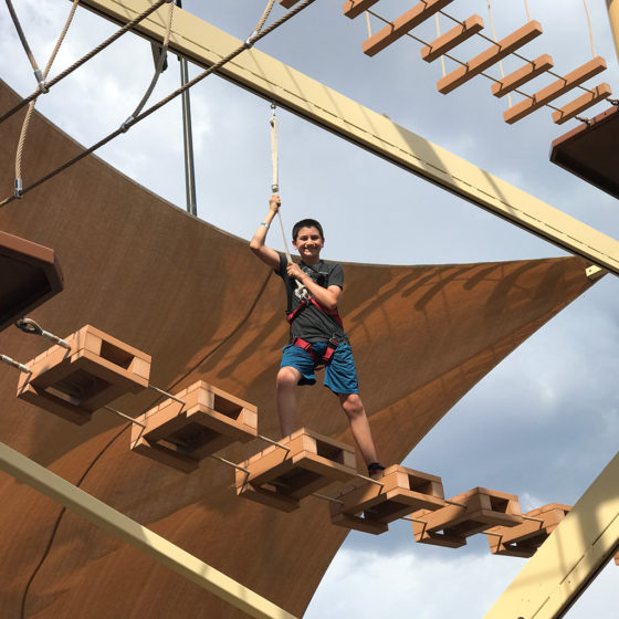 Carter Bourn Completing A Ropes Course