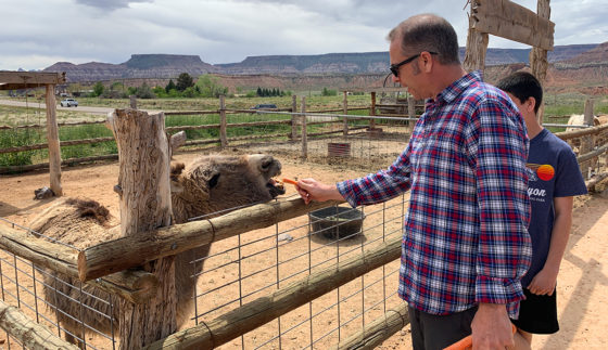 Brian Bourn Feeding Animals at the Fort Zion Petting Zoo